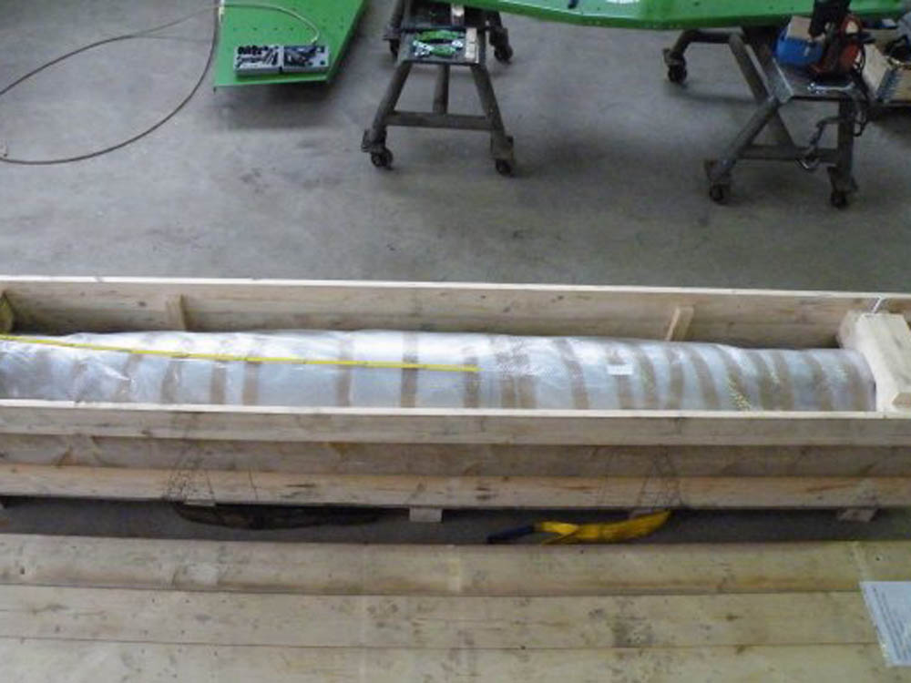 Verpacktes Ersatzteil für den Versand | BSS GmbH Verpacktes Maschinenbauteil in einer Holzkiste